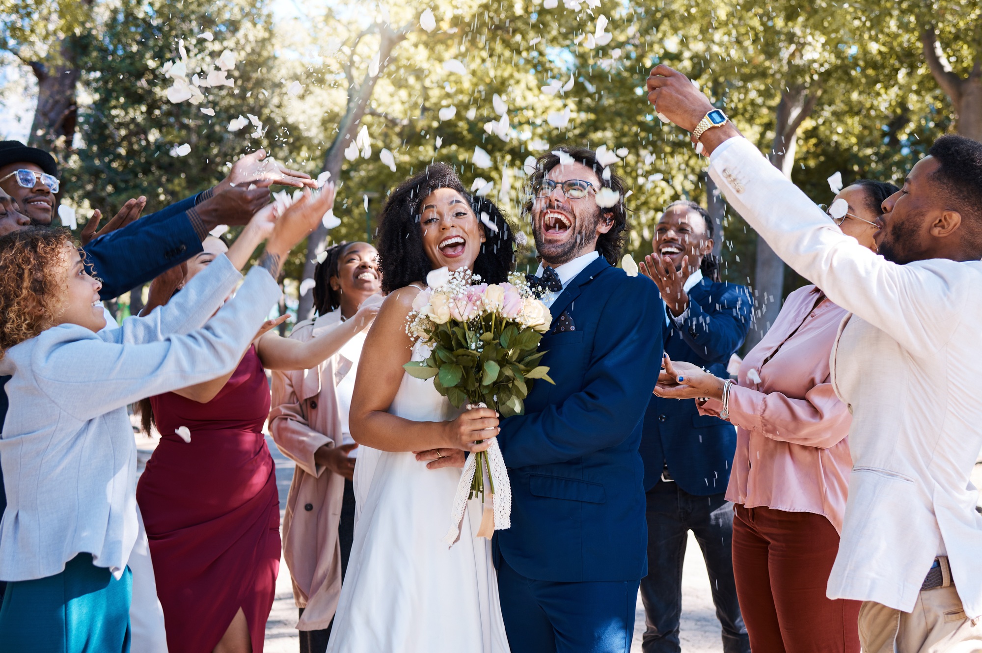 Wedding confetti, marriage couple and celebration of audience throwing flower petals outdoor. Happi